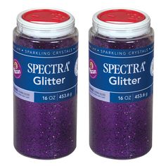 two jars filled with purple glitter sitting next to each other