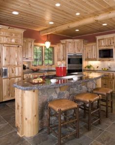 a large kitchen filled with lots of wooden furniture