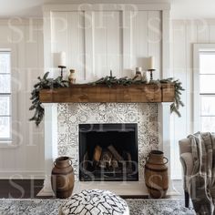 a living room filled with furniture and a fire place in front of a fireplace covered in greenery