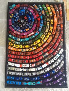 an art piece made out of cars is on display