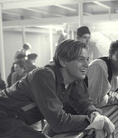 a group of young men sitting next to each other