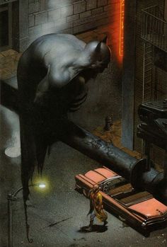 a man standing next to a giant bat in the middle of a city at night