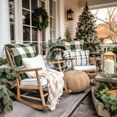 a porch with rocking chairs and christmas decorations