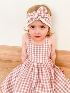 Pretty handmade girls summer dress. Pretty sweetheart neckline.  Back of the dress ties with a bow.  Pockets!  Skirt length just above the knee. Head scarf included x Made from beautiful dusty pink & white gingham fabric - 100% cotton. * Sizes 2 to 6 available for order Please note these dresses are made to order.  Please allow 2 weeks for your custom order to be made x Summer Picnic Dress With Bow Detail, Summer Picnic Dress With Bow, Cute Cotton Dresses For Picnic, Cute Gingham Dresses For Garden Party, Cute Cotton Dress With Bow Tie Back, Cute Sundress For Picnic, Cute Cotton Dresses With Tie Straps, Pink Cotton Sundress For Picnic, Cute Cotton Dress With Tie Straps