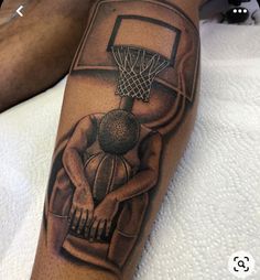 a man with a basketball tattoo on his leg