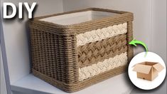 an empty basket sitting on top of a shelf next to a cardboard box with the lid open