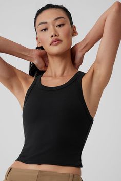 The name says it all: The Goddess Ribbed Go-To Tank fits like your best basic tank, with a racerback and cropped hem—but it’s made from a buttery-soft, ribbed performance fabric that’s perfect for practice. Layer it over a sports bra for movement, then pair it with trousers for an effortless street-style look. Alo Yoga Fitted Sporty Tank Top, Alo Yoga Ribbed Athleisure Top, Sporty Ribbed Cropped Tank Top, Alo Yoga Fitted Tank Top For Sports, Alo Yoga Fitted Sports Tank Top, Black Ribbed Tank Top For Yoga, Alo Yoga Sleeveless Summer Tank Top, Alo Yoga Summer Sleeveless Tank Top, Alo Yoga Sleeveless Tank Top For Summer