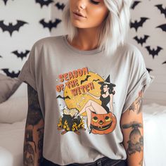 Available in other Colors-Vintage Inspired Witchy Halloween Graphic Tee Ash, Clay, Musturad, Lilac, Berry, White, Pink and Peach Sizing Chart in photo section See more Halloween items at https://modernostalgiaco.etsy.com Free Shipping-Over $35 or more See shipping time for details. If available it will ship out early, we strive to get all orders out within one to three business days. Vintage Crew Neck Halloween Tops, Spooky Cotton Top For Costume Party, Spooky Cotton Tops For Costume Party, Vintage Crew Neck Tops For Halloween, Spooky Funny Print Tops For Fall, Fall Costume Party Short Sleeve T-shirt, Witchy Letter Print T-shirt For Fall, Fall Short Sleeve T-shirt For Costume Party, Fall Short-sleeved T-shirt For Costume Party