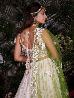 This ivory chikankari lehenga is detailed with zardosi, pearls and sequins on a georgette base. It is paired with a tussar silk blouse that has a scalloped neckline.  The outfit is completed with a  contrast green net dupatta. Chikankari Lehenga, Scalloped Neckline, Net Dupatta, Embroidered Skirt, Scalloped Hem, Cut Work, Embroidery Details, 404 Page Not Found, Silk Blouse