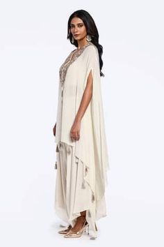 Off white asymmetric kaftan with zardozi embroidered floral motifs. Comes with inner bustier and draped pant. - Aza Fashions Bollywood Style Embellished V-neck Kaftan, Bollywood Style Embroidered Kaftan, Cream Embroidered Kaftan, Designer Embroidered V-neck Kaftan, Bollywood Style Embroidered V-neck Kaftan, Rhea Kapoor, Mira Rajput, Sanya Malhotra, Drape Pants