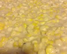 corn is being cooked in a large pot