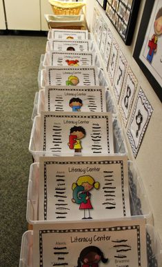 several plastic bins filled with books and pictures