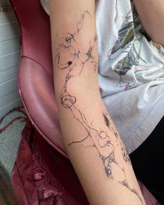 a person with a tattoo on their arm