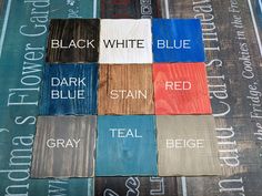 several different colors of wood with words on them that read black, white, blue, red, gray, teal, and brown