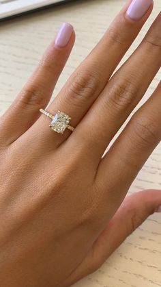 a woman's hand with a ring on it