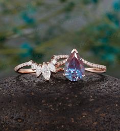 two engagement rings on top of a rock