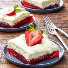 two slices of strawberry cake on blue plates