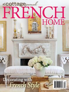 the cover of cottage journal french home featuring a white bench with flowers in front of a fireplace