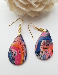 Handmade Earrings Sculpey Clay  Resin sealed  2.5 inches tall Gold hypoallergenic wires Set of rubber backings included  Beautiful piece of jewlery for any occasion No harsh chemicals to clean!! If piece gets scratched, you can use a resin polish Cadmium-free Teardrop Earrings For Gifts, Cadmium-free Teardrop Earrings As Gift, Multicolor Teardrop Hoop Earrings Gift, Artsy Teardrop-shaped Earrings, Adjustable Teardrop Artsy Earrings, Artistic Adjustable Teardrop Jewelry, Adjustable Artistic Teardrop Jewelry, Multicolor Hypoallergenic Teardrop Earrings As Gift, Artsy Multicolor Teardrop Jewelry