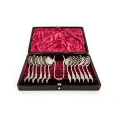 a set of forks and spoons in a case