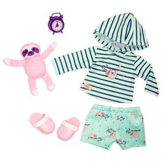 the doll is dressed in blue and white striped clothing with pink accessories including a stuffed animal