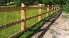 a wooden fence with wire around it