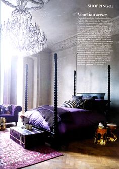 a bedroom with purple furniture and chandelier