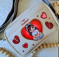 This cute chicana style purse is ready to find her forever home. Perfect purse for any occasion. It is not to big or small.Material is vegan leather. Measurements: 9.04 in x 2.75 in x5.50 min All design is sealed with acrylic to prevent from breaking or scratching.For more detailes, the image includes rhinestones. Due to acrylic, to much exposure of sun light might change image color. Please handle your bag with care. Crossbody Bags With Card Slots For Gift, Gift Crossbody Bag With Card Slots, Gift Crossbody Shoulder Bag With Card Slots, Chicana Style, Perfect Purse, Sun Light, Change Image, Forever Home, Hand Bag