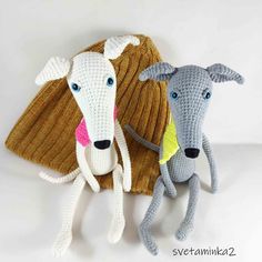 two crocheted animals sitting next to each other