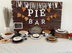 a table topped with pies and pie bars