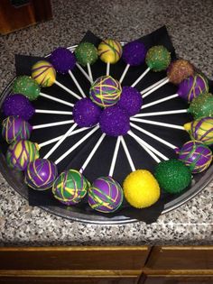 there is a cake decorated with purple and green candies