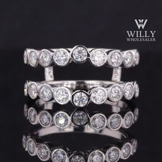 three rows of white gold and diamond rings on a black background with the words willly written