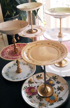 there are many plates on the table and one has a gold plate in front of it