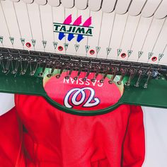 a close up of a red jacket with the number 00 on it and some strings