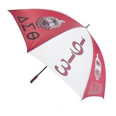 an open umbrella with the word cake printed on it's side and red, white, and black letters