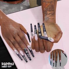 a woman's hands with black and white nail art