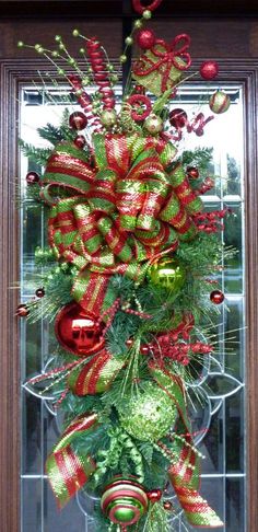 a christmas wreath with red and green decorations