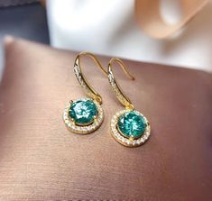 Welcome to Elegant Art Jewelry!  Stone: White Moissanite, Green Moissanite Stone Size: 6.5mm Metal: 925 Sterling Silver Side Stone: Zircon Personalization: 9K/14K/24K/GOLD/SILVER/PLATINUM/ROSE-GOLD/WHITE GOLD. (Contact me)  Moissanite Earrings, Moissanite Cuff Earrings, Gold Earrings, Gold Stud Earrings, 14k Gold Earrings, 14k Gold Earrings, Round Cut Earrings, Round Cut Stone Earrings, Round Cut Studs Earrings, Moissanite Drop Earrings, Moissanite Studs Earrings, Moissanite Studs, Moissanite Ea Green Moissanite, Platinum Rose Gold, Wedding Earrings Drop, Cut Earrings, Paraiba Tourmaline, Luxury Earrings, Earrings Round, Jewelry Stone, Moissanite Earrings