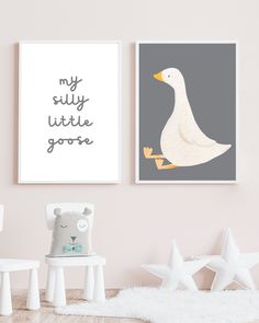 two posters on the wall in a child's room with white furniture and toys