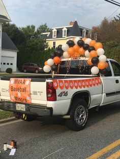 a white truck with balloons in the back