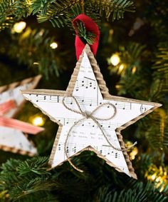 a wooden star ornament hanging from a christmas tree