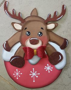 a christmas ornament with a reindeer on it