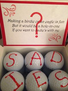 six golf balls in a box with the word sale painted on them to spell out their name