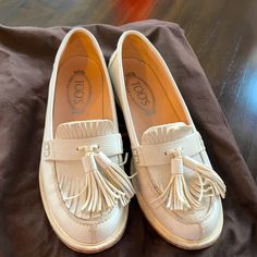 Cool. Elegant. And Super Wearble. Walkable. Perfect For The Coming Spring. Size 6.5. I Am In Between 6.5 And 7 And The Shoes Are A Little Tight For Me. No Wear On The Surface. No Wear In Sole. Light Wear In Heels. Luxury Round Toe Loafers For Spring, White Round Toe Casual Tassel Loafers, Luxury Spring Loafers With Round Toe, White Leather Tassel Loafers For Spring, Designer Tassel Loafers With Branded Insole And Round Toe, White Casual Tassel Loafers With Round Toe, Casual Wingtip Loafers For Spring, Casual Spring Wingtip Loafers, Slip-on Wingtip Moccasins For Spring