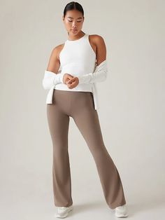 Salutation Stash Flare Pant | Athleta Compressive Beige Yoga Bottoms, Beige Stretch Yoga Pants, Versatile Fall Yoga Activewear, Beige Athleisure Yoga Leggings, Beige Athleisure Leggings For Yoga, Athleisure Beige Leggings For Yoga, High Stretch Athleisure Bottoms For Relaxation, Versatile Fall Activewear For Relaxation, Stretch Pants For Relaxation During Fall