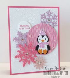 a card with a penguin and snowflakes on it