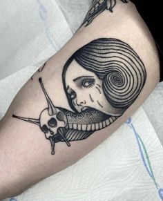 a black and white tattoo with a woman's face