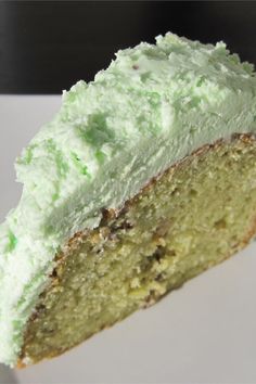 a piece of green cake on a white plate