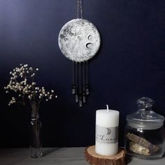 a white candle sitting on top of a wooden table