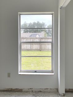 an empty room with a large window in it